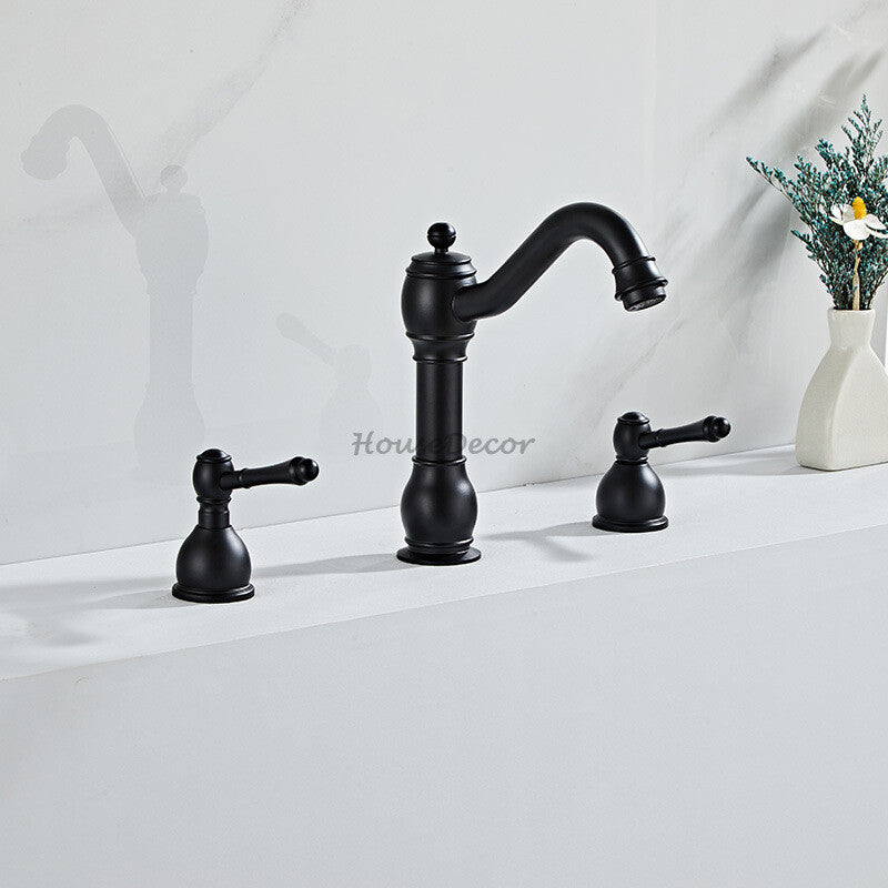 Brass bathroom basin mixer tap dual handle control detail view