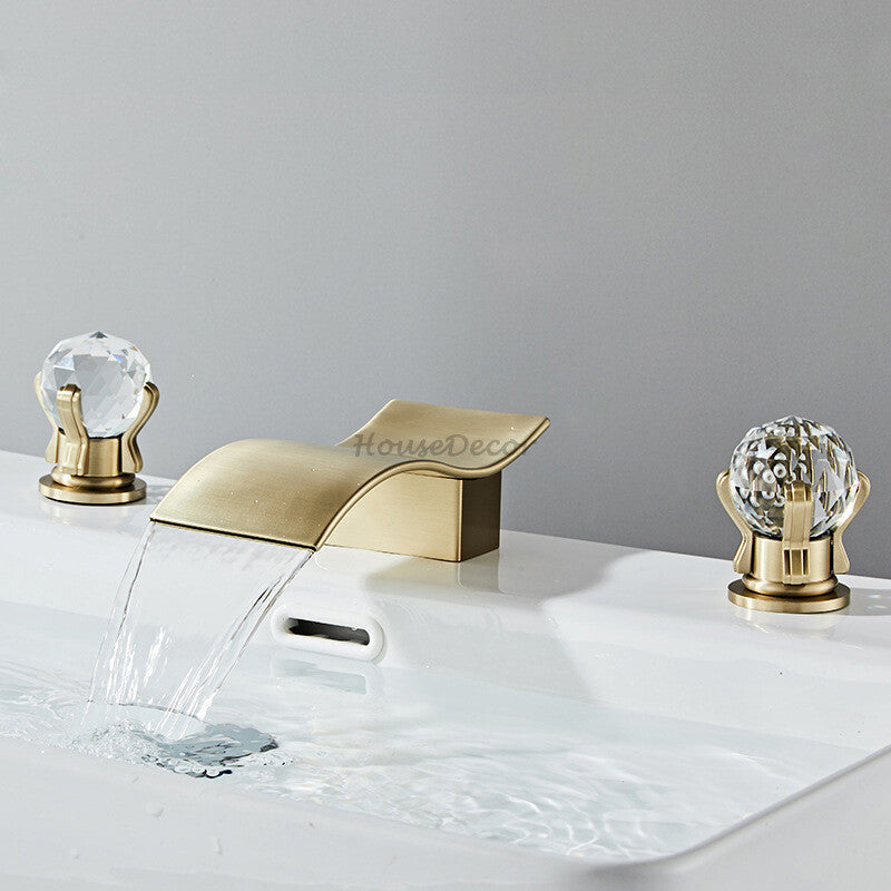 Modern bathroom basin mixer tap waterfall spout detail view