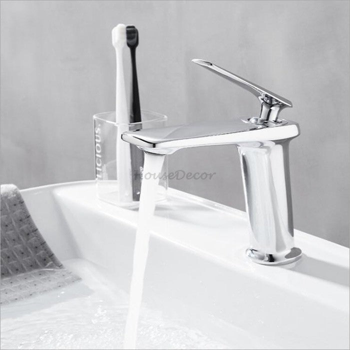 Black Brass bathroom basin mixer tap waterfall spout detail view