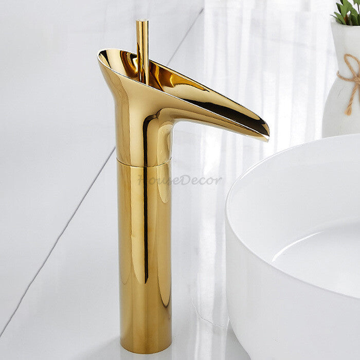 Gold bathroom basin mixer tap waterfall spout detail view