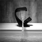 Modern bathroom basin mixer tap waterfall spout detail view