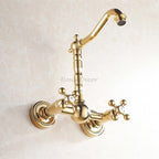 Gold kitchen sink mixer tap swivel spout detail view