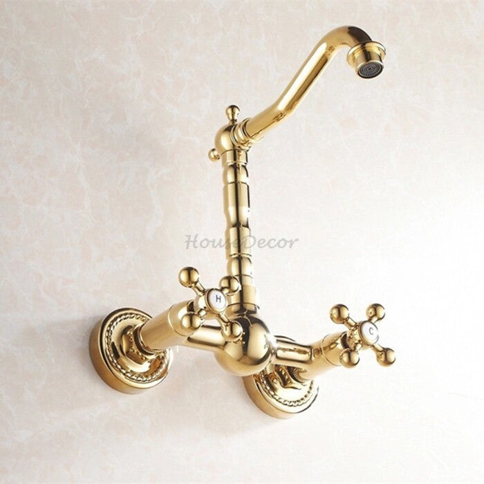 Gold kitchen sink mixer tap swivel spout detail view
