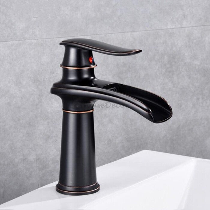 Black bathroom basin mixer tap waterfall spout detail view