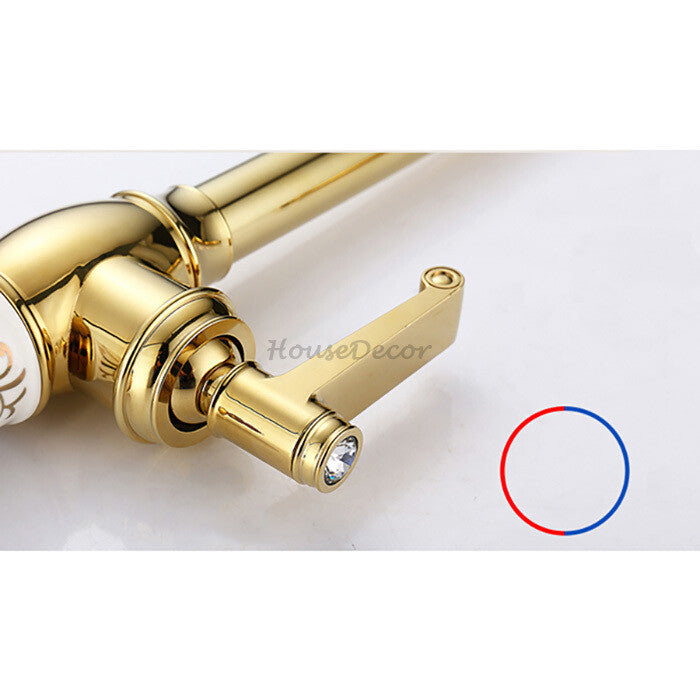 Gold kitchen sink mixer tap swivel spout detail view