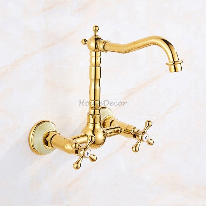 Gold kitchen sink mixer tap swivel spout detail view
