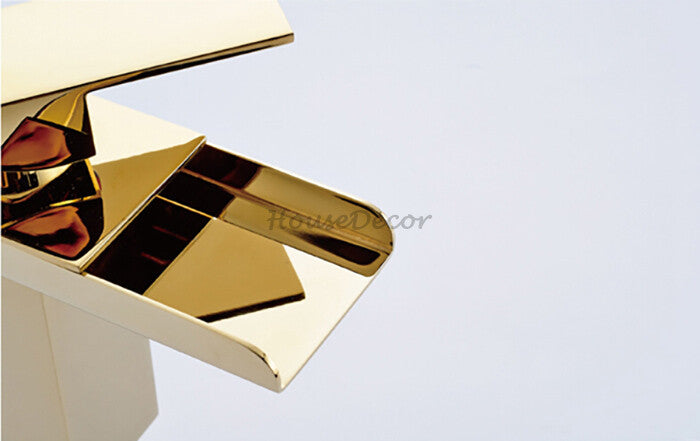 Gold bath shower mixer tap waterfall spout detail view