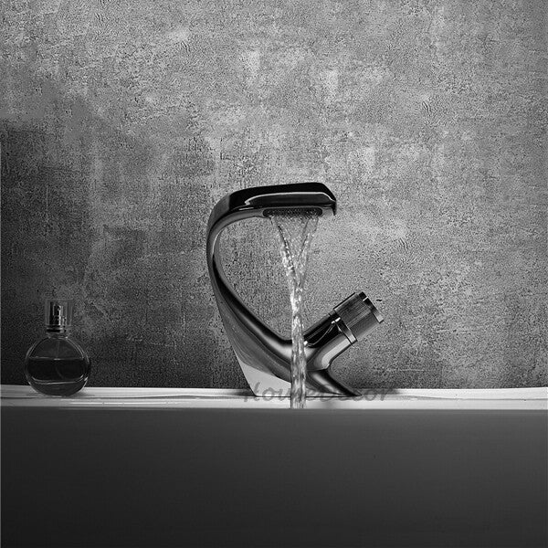 Modern bathroom basin mixer tap waterfall spout detail view
