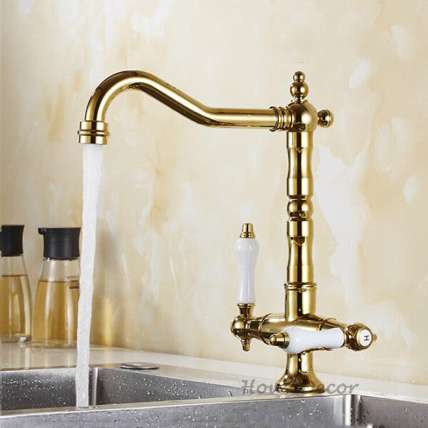 Gold kitchen sink mixer tap swivel spout detail view