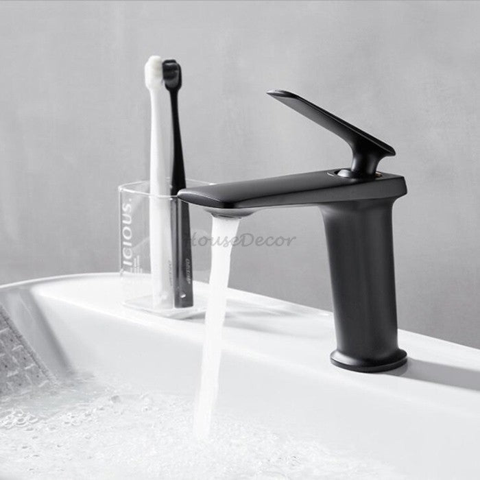 Black Brass bathroom basin mixer tap waterfall spout detail view