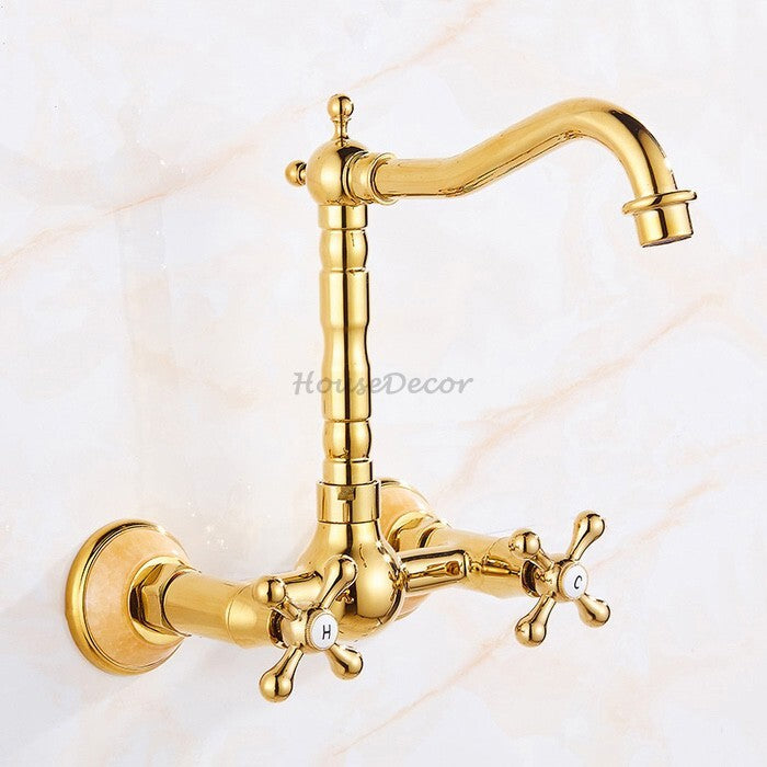 Gold kitchen sink mixer tap swivel spout detail view
