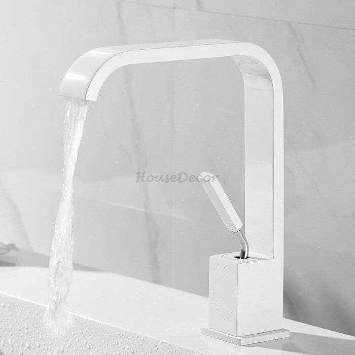 Modern bathroom basin mixer tap waterfall spout detail view