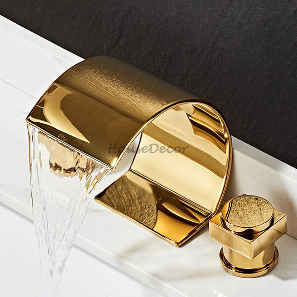 Gold bath shower mixer tap waterfall spout detail view