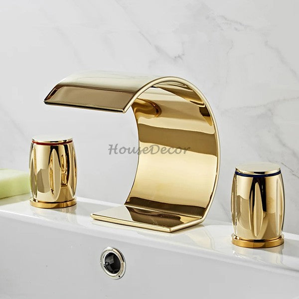 Gold bath shower mixer tap waterfall spout detail view