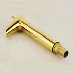 Gold bathroom basin mixer tap waterfall spout detail view