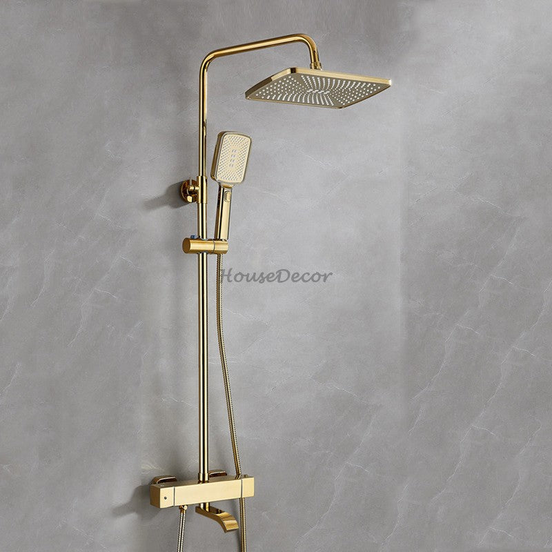 Gold bath shower mixer tap thermostatic control detail view