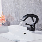 Modern Brass bath shower mixer tap waterfall spout detail view
