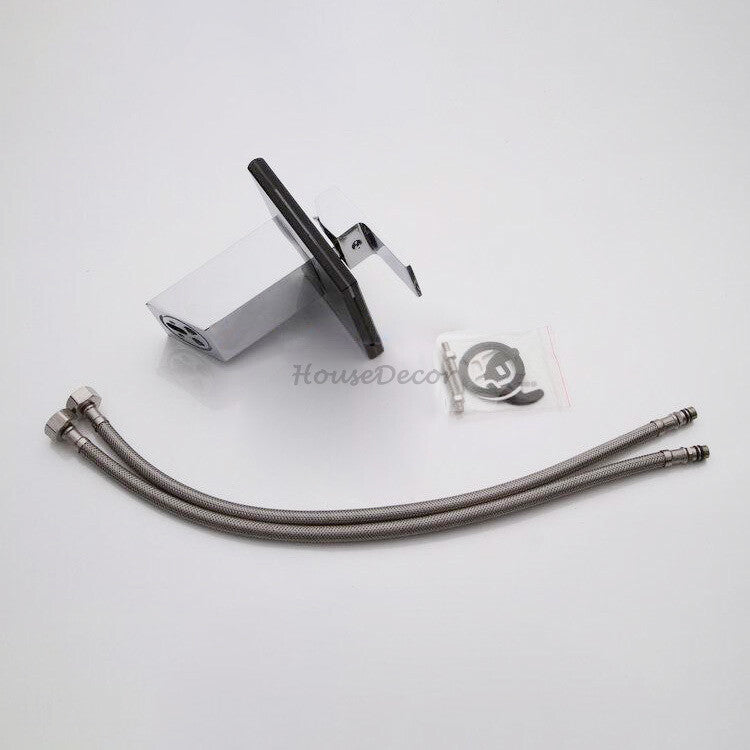 Chrome bathroom basin mixer tap waterfall spout detail view