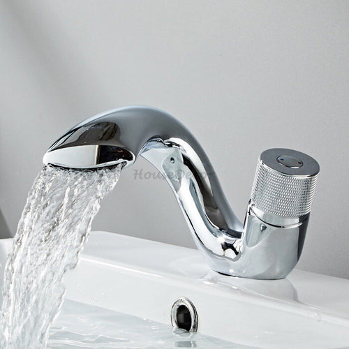 Brass bathroom basin mixer tap waterfall spout detail view
