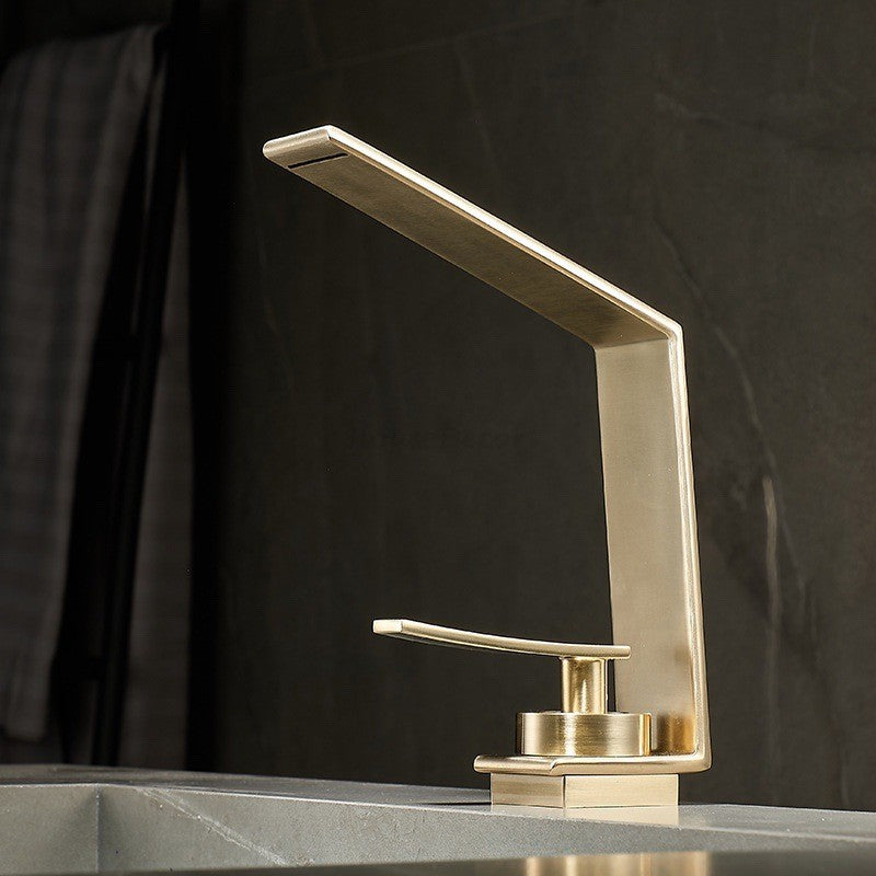 Modern bathroom basin mixer tap waterfall spout detail view