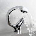 Modern bathroom basin mixer tap waterfall spout detail view