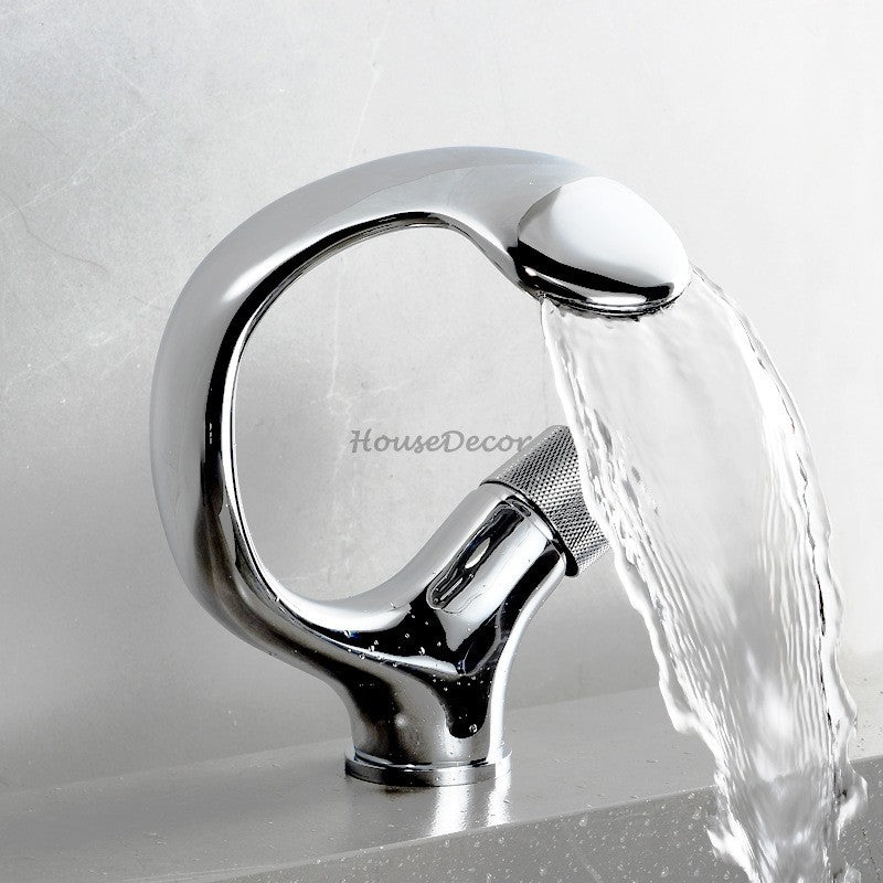 Modern bathroom basin mixer tap waterfall spout detail view