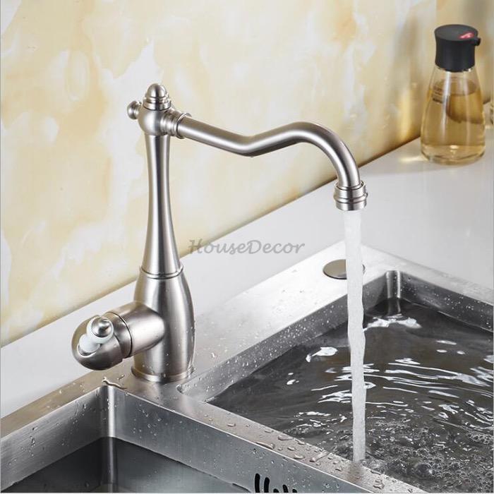 Modern kitchen sink mixer tap swivel spout detail view
