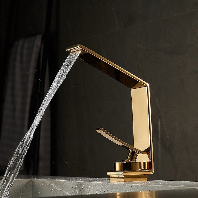 Modern bathroom basin mixer tap waterfall spout detail view
