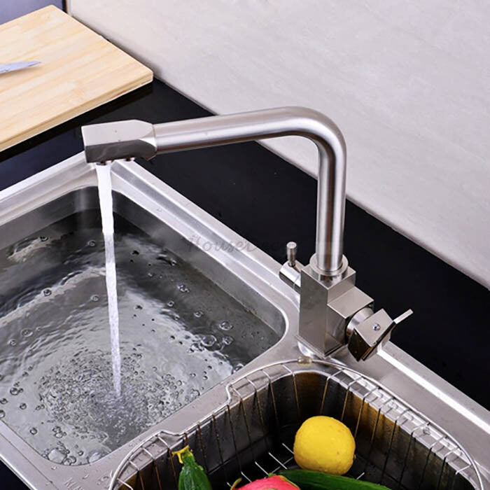 Modern kitchen sink mixer tap swivel spout detail view