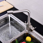 Modern kitchen sink mixer tap swivel spout detail view