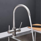 Modern kitchen sink mixer tap swivel spout detail view
