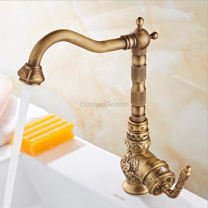 Brass kitchen sink mixer tap swivel spout detail view