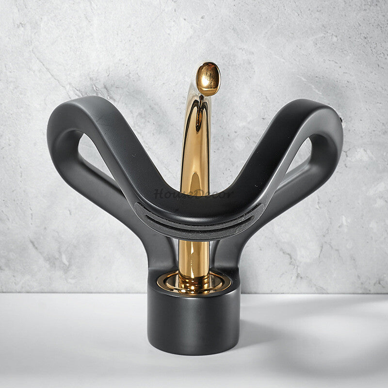 Modern bathroom basin mixer tap waterfall spout detail view