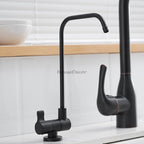 Modern kitchen sink mixer tap swivel spout detail view