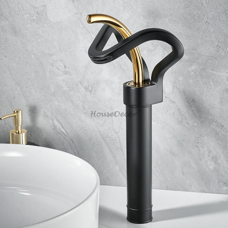 Modern bathroom basin mixer tap waterfall spout detail view