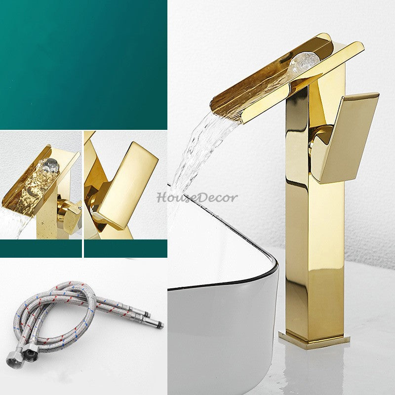 Gold bathroom basin mixer tap waterfall spout detail view