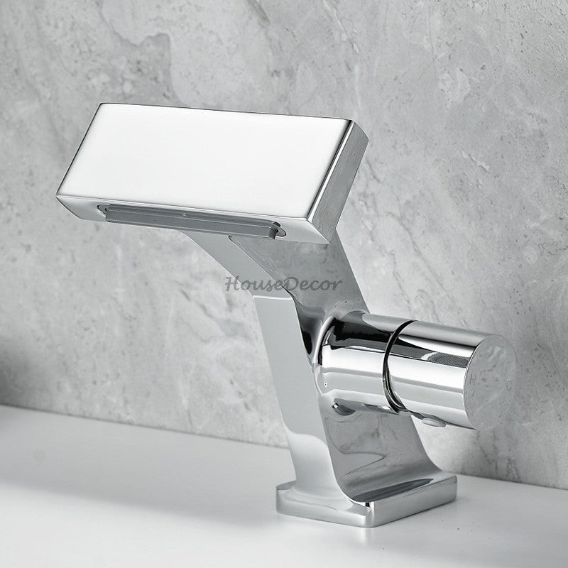 Brass bathroom basin mixer tap waterfall spout detail view