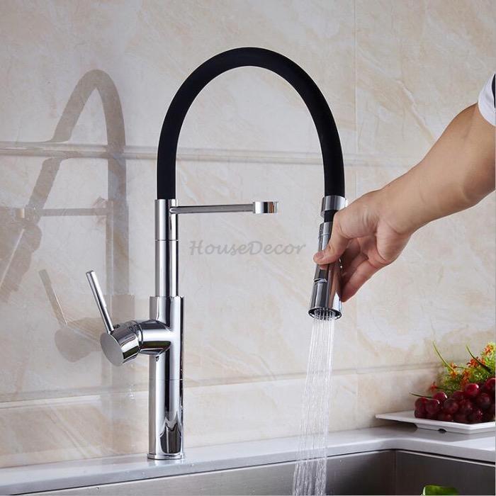 Modern kitchen sink mixer tap swivel spout detail view