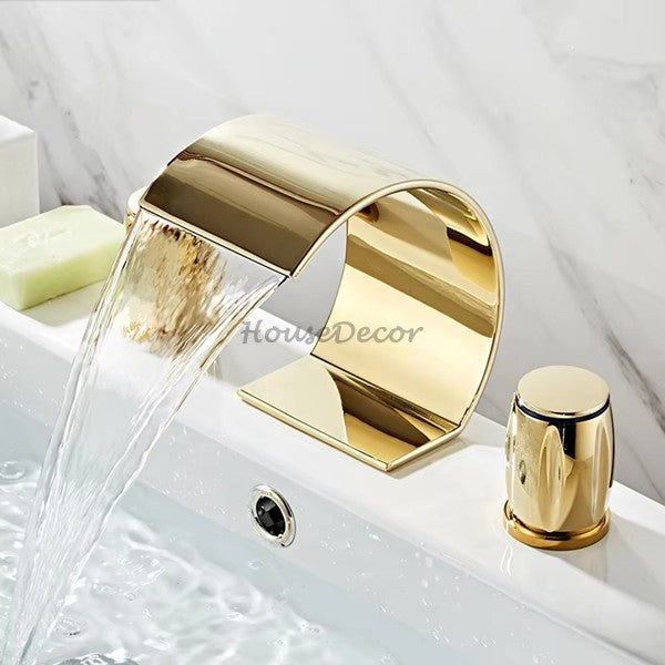 Gold bath shower mixer tap waterfall spout detail view