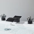 Modern bathroom basin mixer tap waterfall spout detail view