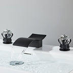 Modern bathroom basin mixer tap waterfall spout detail view