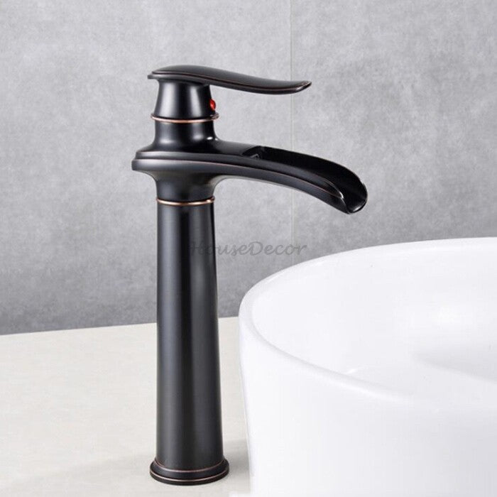 Black bathroom basin mixer tap waterfall spout detail view